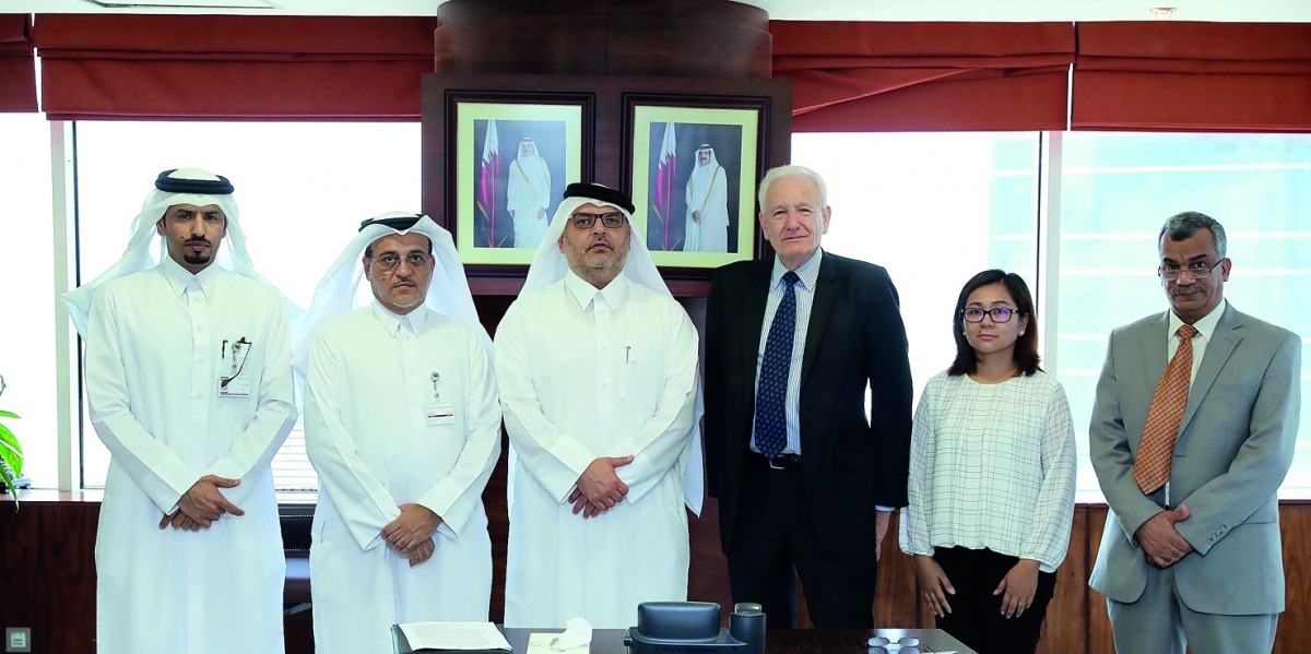 President of Ashghal, Dr. Eng. Saad bin Ahmed Al Muhannadi, with Paul Stennet, Chief Executive of the United Kingdom Accreditation Service, and other officials during the signing of the MoU. 
