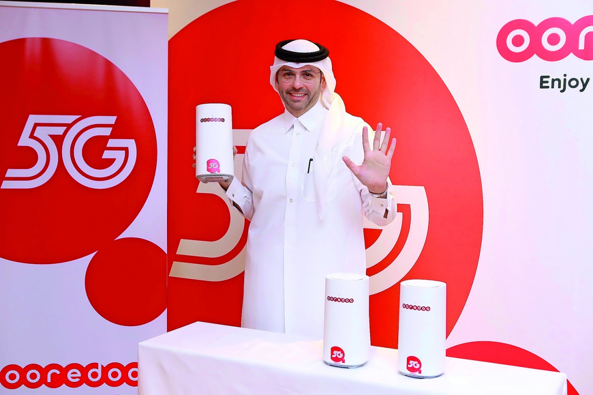 Ooredoo Group Chief Technolgy Officer Ahmad Abdulaziz Al Neama with the new 5G devices. 