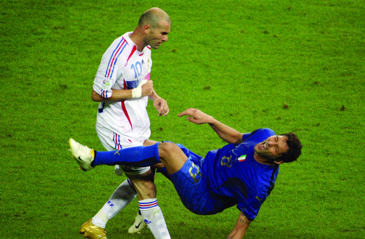In this file photo taken on July 09, 2006 shows French midfielder Zinedine Zidane (L) gesturing after head-butting Italian defender Marco Materazzi during the World Cup 2006 final football match between Italy and France at Berlin’s Olympic Stadium.  AFP /