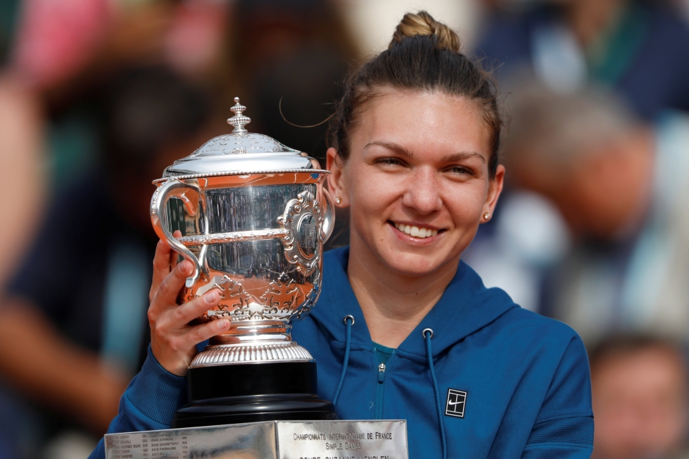 Romania’s Simona Halep celebrates with the trophy after winning the final against Sloane Stephens of the U.S. (REUTERS/Charles Platiau)