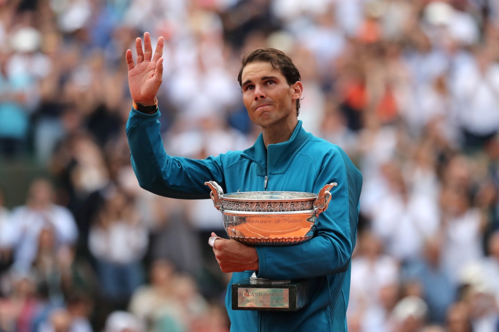 Spain's Rafael Nadal celebrates with the trophy after winning the final against Austria's Dominic Thiem (REUTERS/Pascal Rossignol)