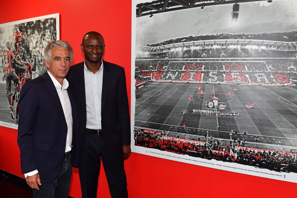 French former Arsenal and France star Patrick Vieira (R), world and European champion with Les Bleus, poses with French L1 football club of OGC Nice's president Jean-Pierre Rivere (L) at the end of a press conference after being officialy appointed the cl