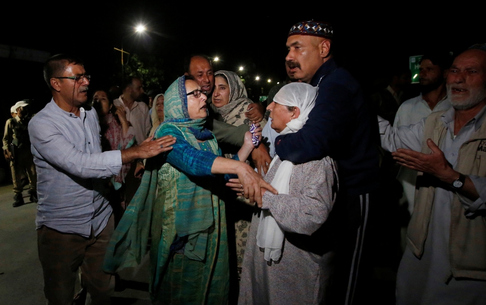 Relatives of Syed Shujaat Bukhari, the editor of Rising Kashmir daily newspaper, mourn after Bukhari was killed by unidentified gunmen outside his office in Srinagar, June 14, 2018. Reuters/Danish Ismail