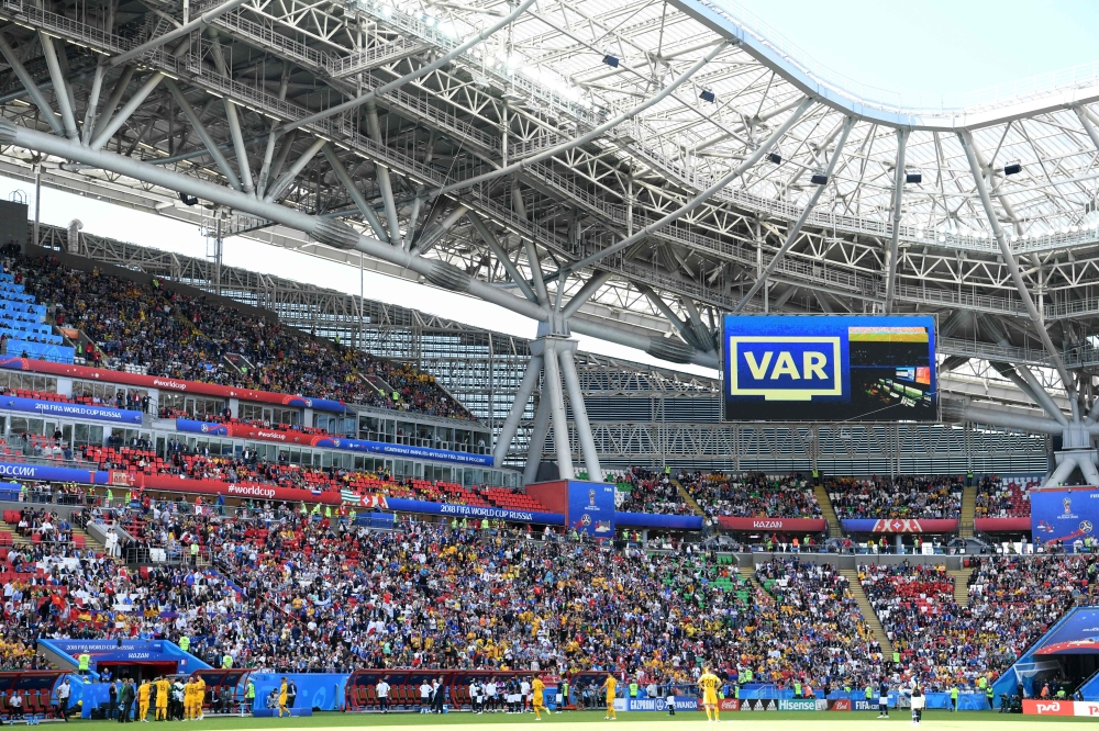 Referees review the Video replay during the Russia 2018 World Cup Group C football match between France and Australia at the Kazan Arena in Kazan on June 16, 2018. (AFP / Kirill KUDRYAVTSEV)