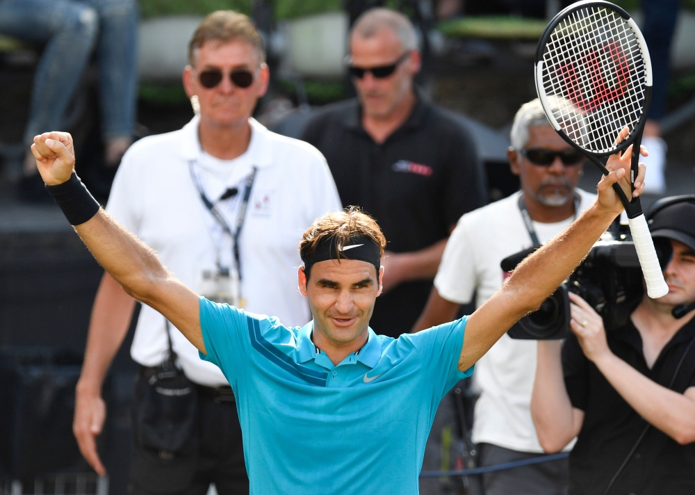 Switzerland's Roger Federer reacts after winning the semi-final match against Australia's Nick Kyrgios at the ATP Mercedes Cup tennis tournament in Stuttgart, southwestern Germany, on June 16, 2018. (AFP / THOMAS KIENZLE)