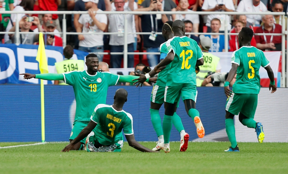 Senegal's M'Baye Niang celebrates scoring their second goal with team mates REUTERS/Maxim Shemetov
