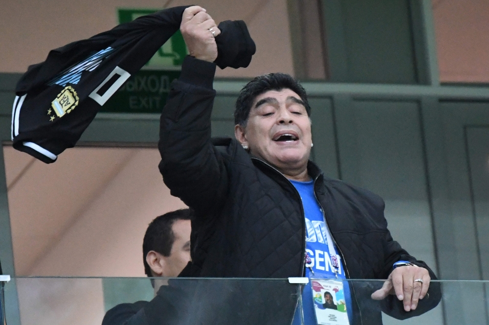 Argentina's football legend Diego Maradona gesturs from the grandstand before the Russia 2018 World Cup Group D football match between Argentina and Croatia at the Nizhny Novgorod Stadium in Nizhny Novgorod on June 21, 2018. AFP / Dimitar DILKOFF
