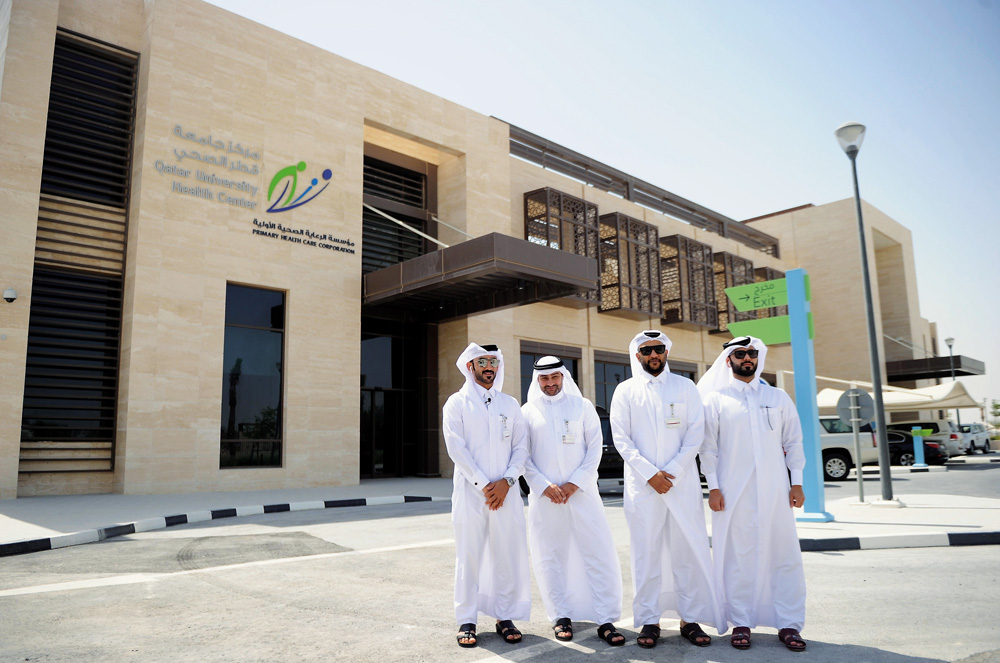 Ahmed Ali Ahmed  Saleh (left), Construction Engineer of Ashghal, with other officials during the visit to Qatar University Health Center, yesterday. BELOW: A view of the health centre. Pics: Abdul Basit / The Peninsula 