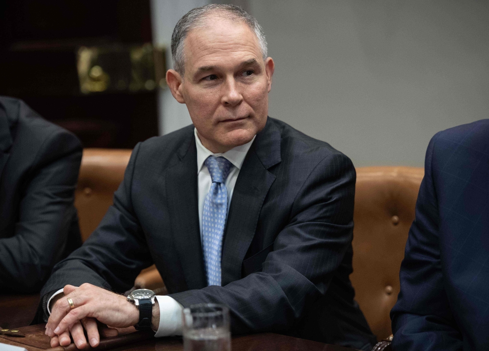 (FILES) In this file photo taken on May 11, 2018 Environmental Protection Agency (EPA) Administrator Scott Pruitt attends a meeting between US President Donald Trump and carmakers in the Roosevelt Room at the White House in Washington, DC. AFP / NICHOLAS 
