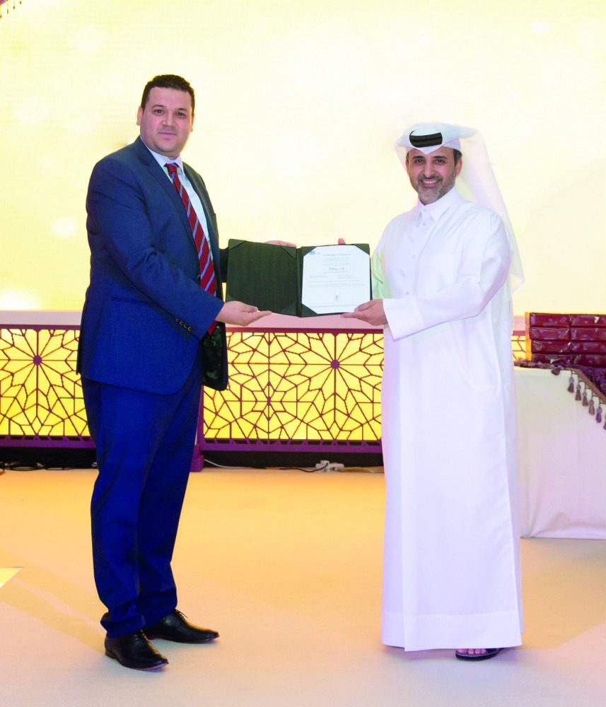 Engineer Abdulla Abdulaziz Turki Al Subaie, Managing Director of Qatar Rail, receiving the ISO renewal certificates.
