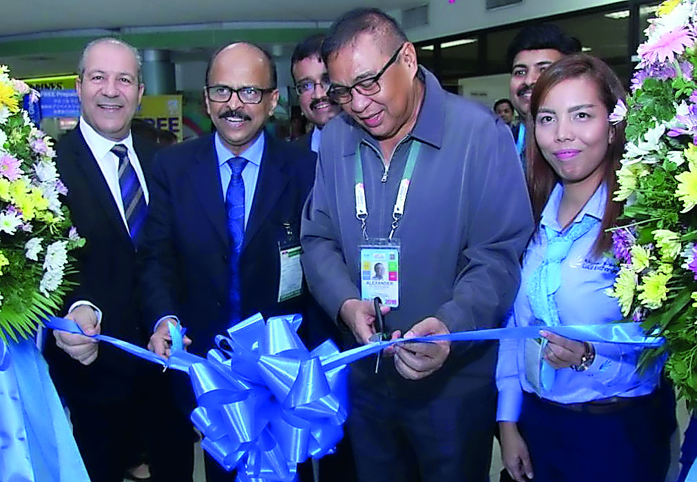 Alexander Cauguiran, Clark International Airport President and Chief Executive, cutting a ribbon marking the opening of Lulu Financial Group’s fourth forex branch, and third 24-hour outlet offering foreign exchange services at the arrival area of Clark In