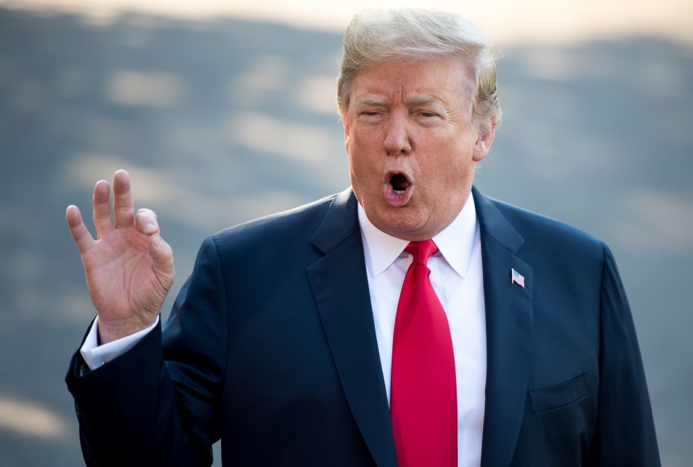 US President Donald Trump speaks to the media as he walks to Marine One prior to departure from the South Lawn of the White House in Washington, DC, July 10, 2018, as they travel on a week-long trip to Europe, with stops in Brussels, London, Scotland and 