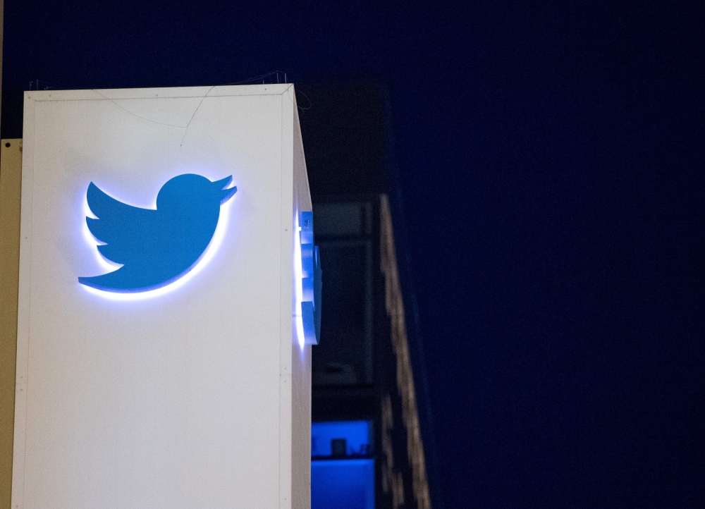 In this file photo taken on November 4, 2016 the Twitter logo is seen on a sign at the company's headquarters in San Francisco, California.  AFP / Josh Edelson

