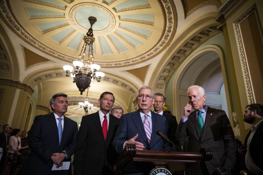 Senate Majority Leader Mitch McConnell (R-KY) speaks with fellow Senate Republicans during a news conference following the weekly Senate Republicans policy luncheon, on Capitol Hill, on July 10, 2018 in Washington, DC. Al Drago/Getty Images/AFP