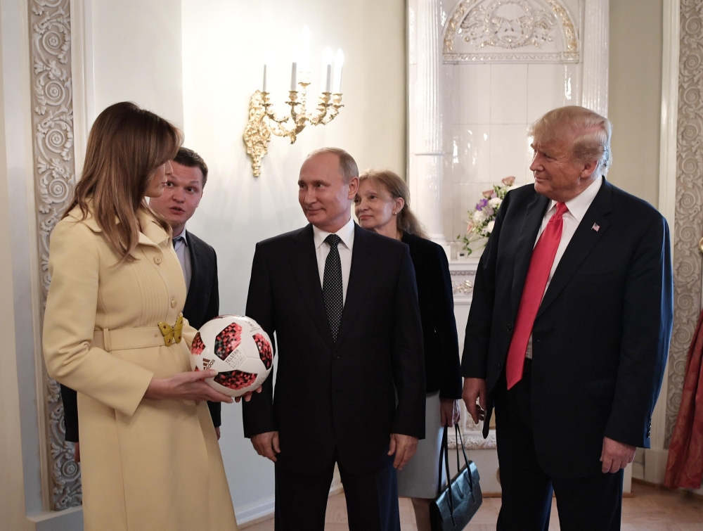 Russia's President Vladimir Putin (C), U.S. President Donald Trump (R) and First lady Melania Trump speak during a meeting in Helsinki, Finland July 16, 2018. Sputnik/Alexei Nikolsky/Kremlin