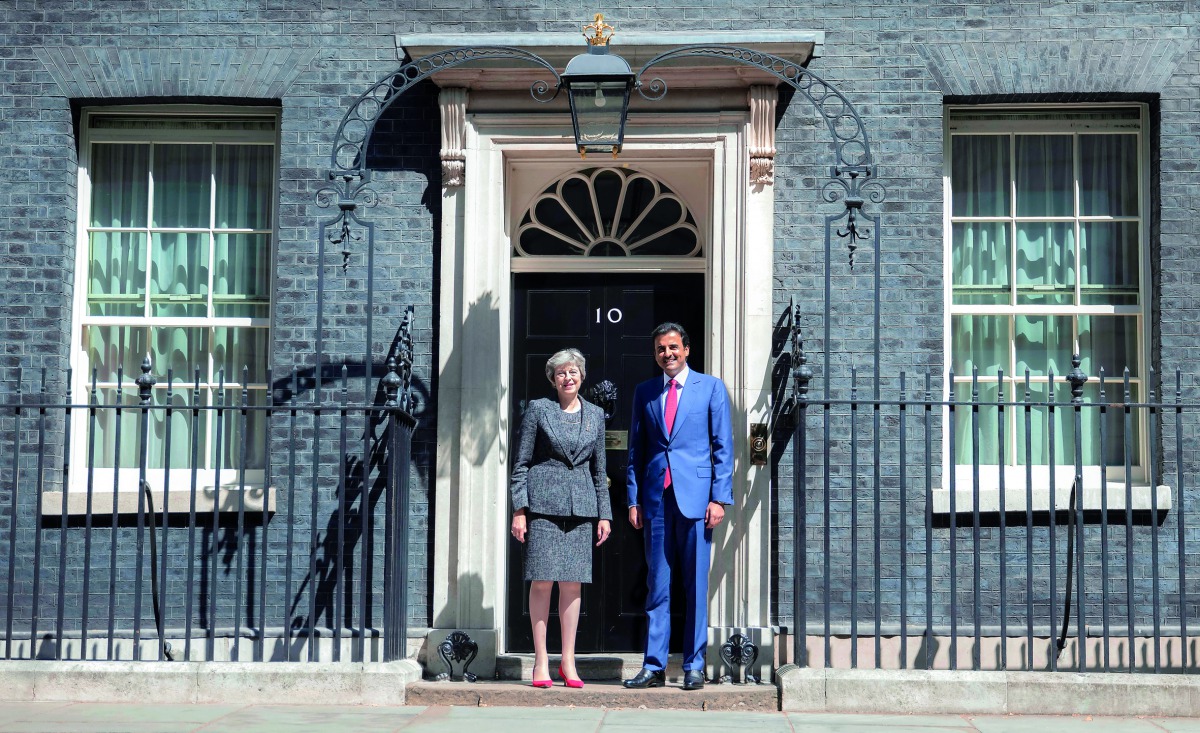 Amir H H Sheikh Tamim bin Hamad Al Thani being welcomed by the Prime Minister of the United Kingdom, Theresa May, at 10 Downing Street in London yesterday.