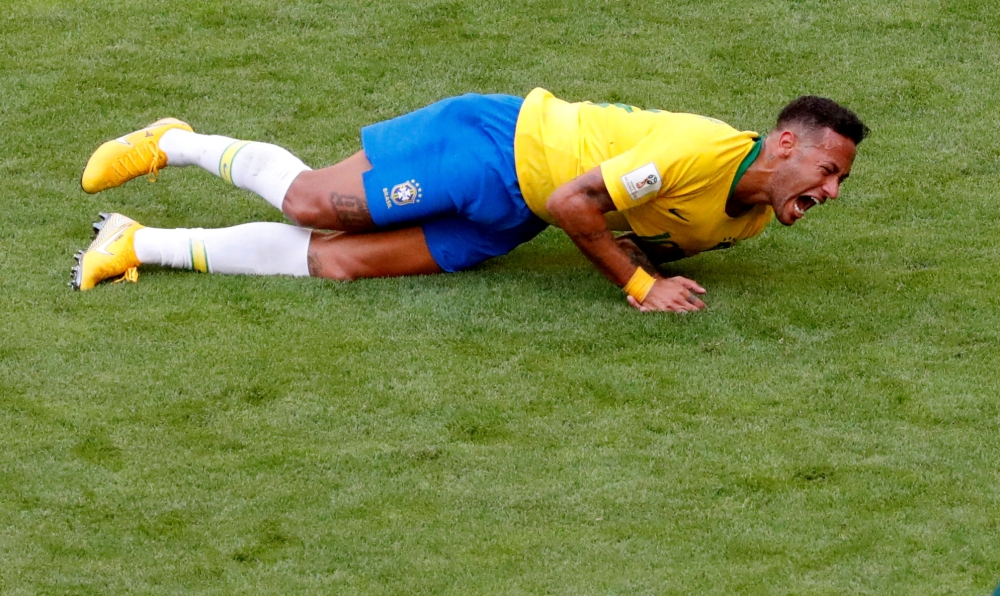 Brazil's Neymar lies on the pitch in match against Mexico at Mexico - Samara Arena, Samara, Russia - July 2, 2018. REUTERS/David Gray/File Photo