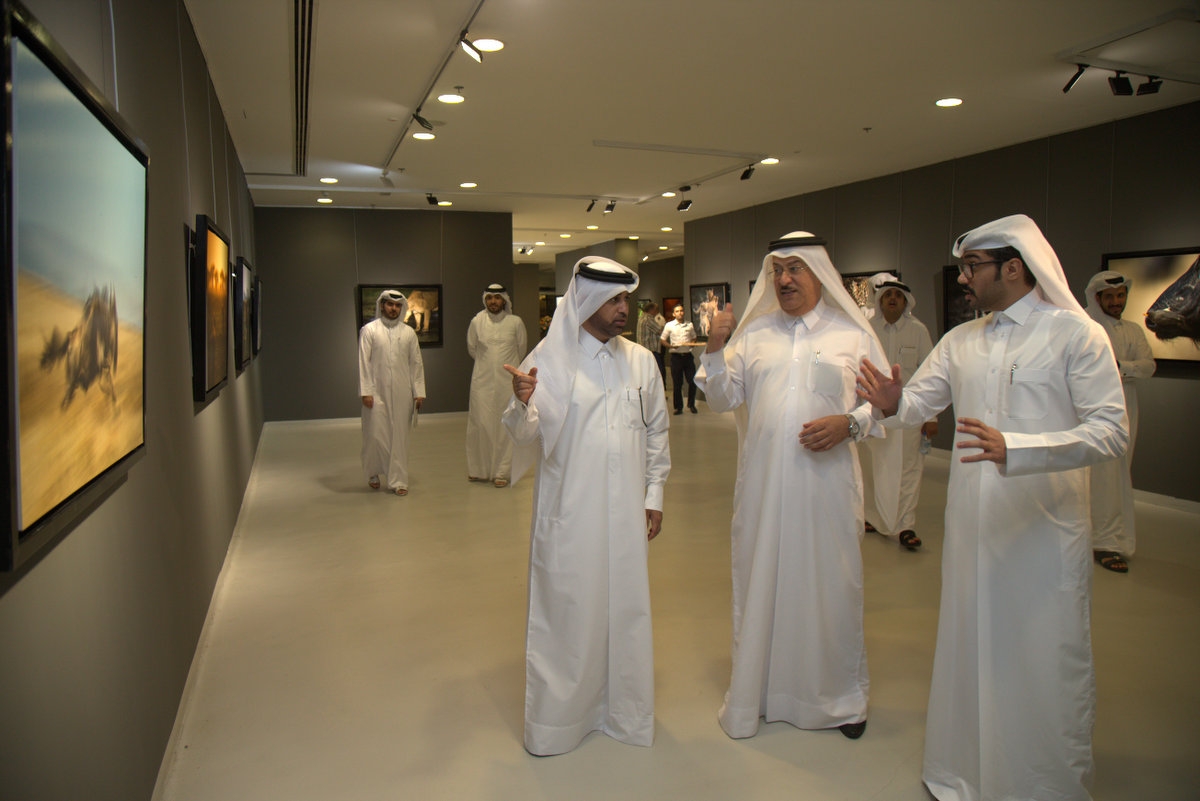 Dr Khalid bin Ibrahim Al Sulaiti, General Manager of Katara, along with other officials tours the African Safari exhibition during its launch on Wednesday at Katara Building 18. MIDDLE and RIGHT: Photos by Ali Al Shamsi on display at the exhibition.