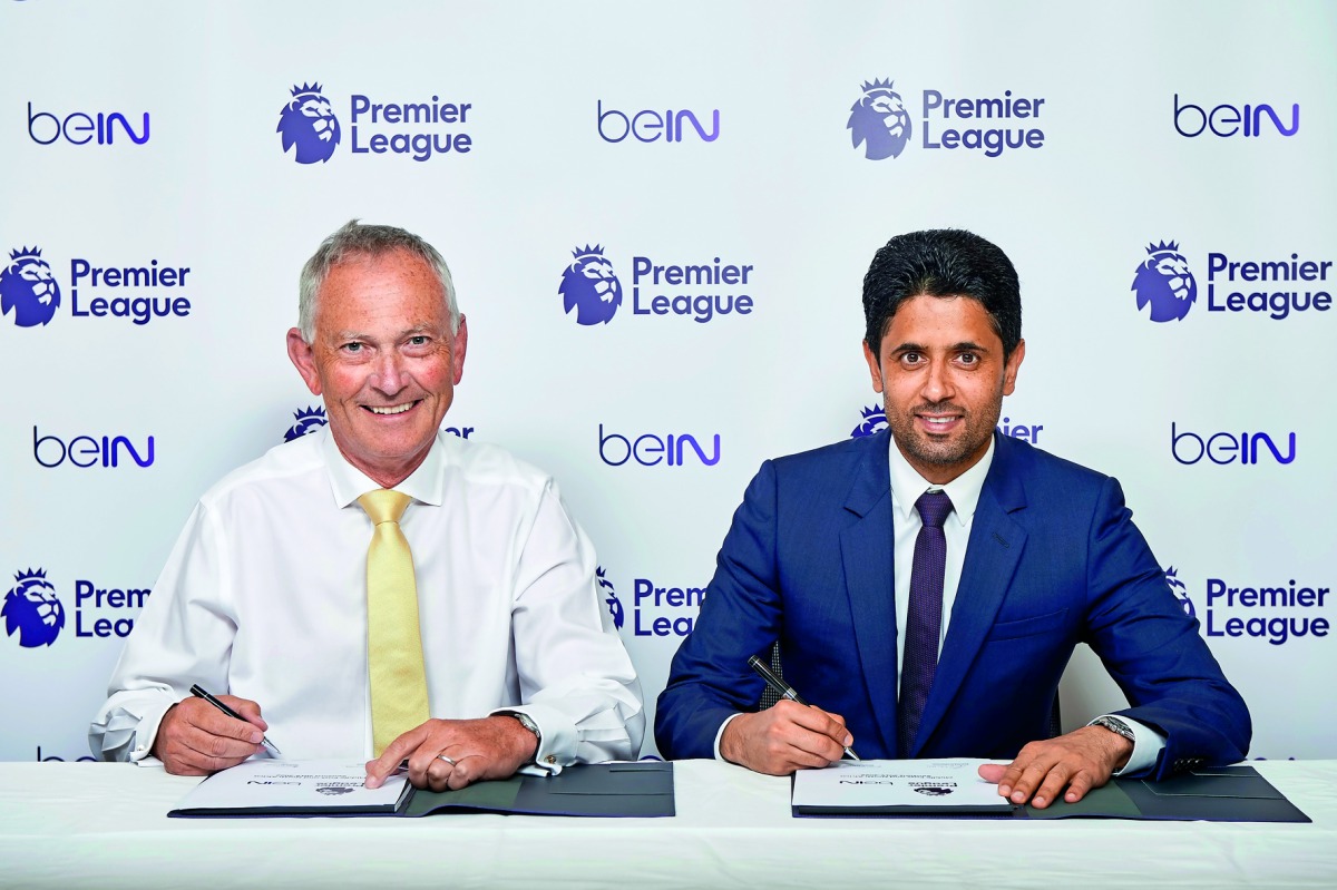 Nasser Al Khelaifi (right), Chairman and CEO of beIN Media Group, and Richard Scudamore, Executive Chairman of the Premier League, signing the agreement.