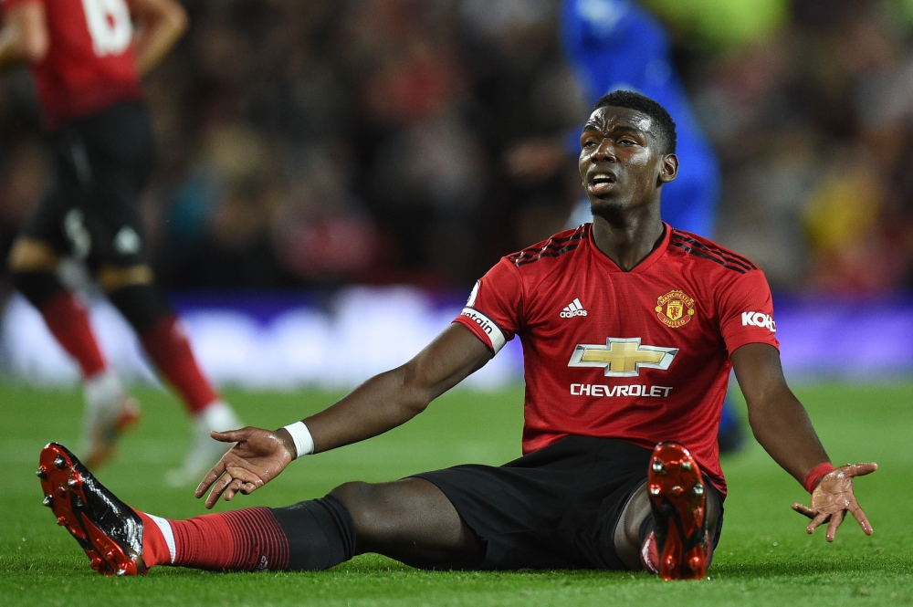 Manchester United's French midfielder Paul Pogba gestures during the English Premier League football match between Manchester United and Leicester City at Old Trafford in Manchester, north west England, on August 10, 2018. (AFP / Oli SCARFF)