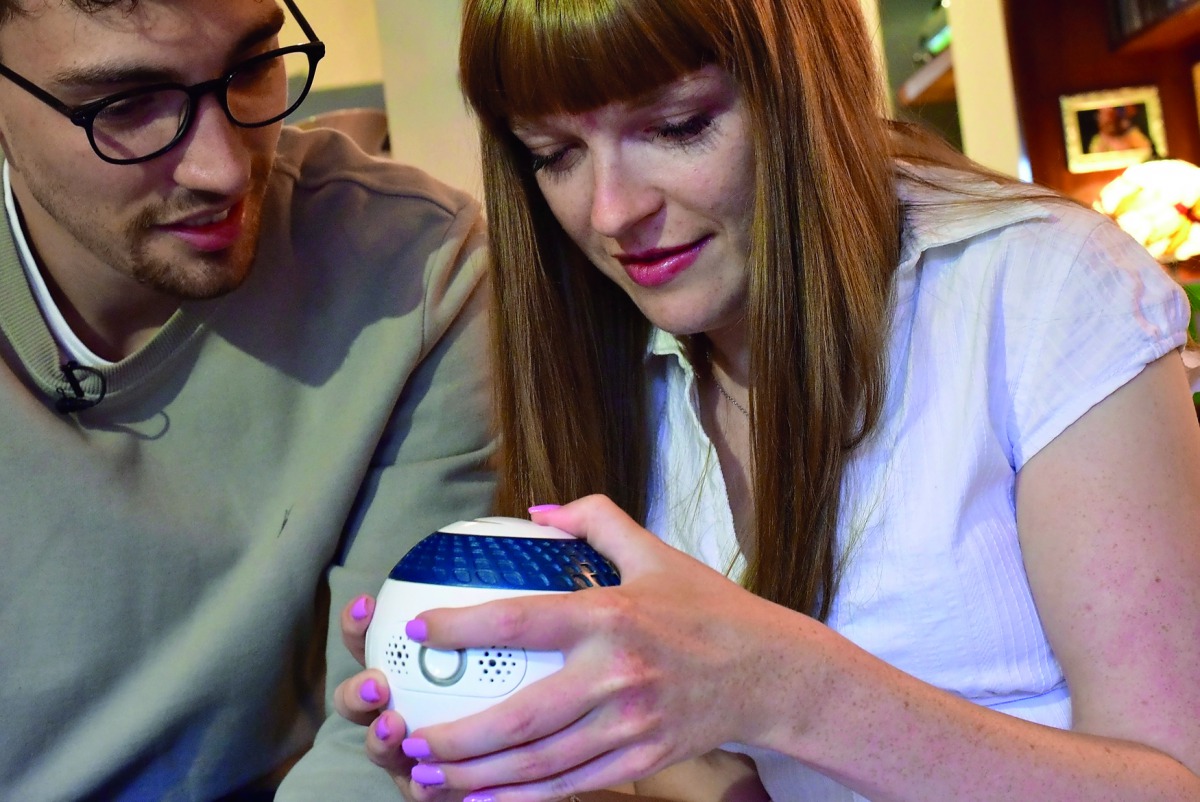 Designer Billy Searle shows his sister Jess how to use 'Mylo', a spherical games controller he has built to help people with disabilities to improve their mental fitness and dexterity in London, Britain August 9, 2018. Reuters/Matthew Stock