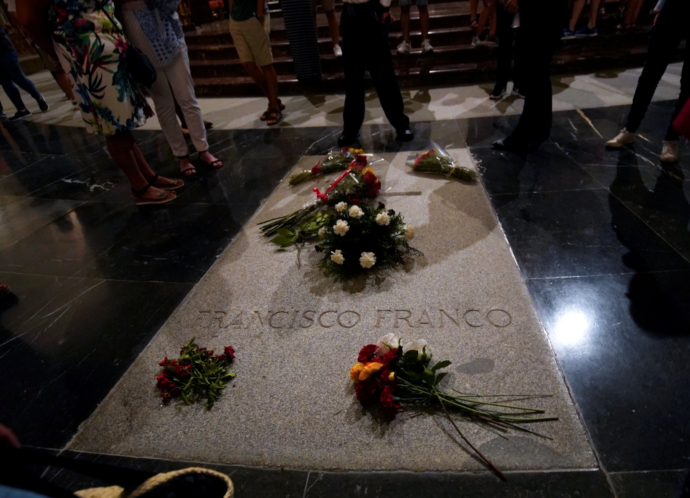 Flowers lie on the tomb of Spanish dictator Francisco Franco at El Valle de los Caidos (The Valley of the Fallen), the giant mausoleum holding the remains of Franco, in San Lorenzo de El Escorial, outside Madrid, Spain, August 24, 2018. REUTERS/Juan Medin