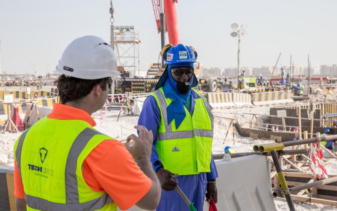 Stadium workers wearing cooling vests.