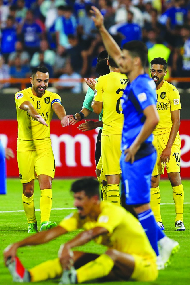 Al Sadd’s Xavi Harnandez (left) during the AFC Champions League football match against Esteghlal FC , Iran at the Azadi Stadium in Tehran on Monday.