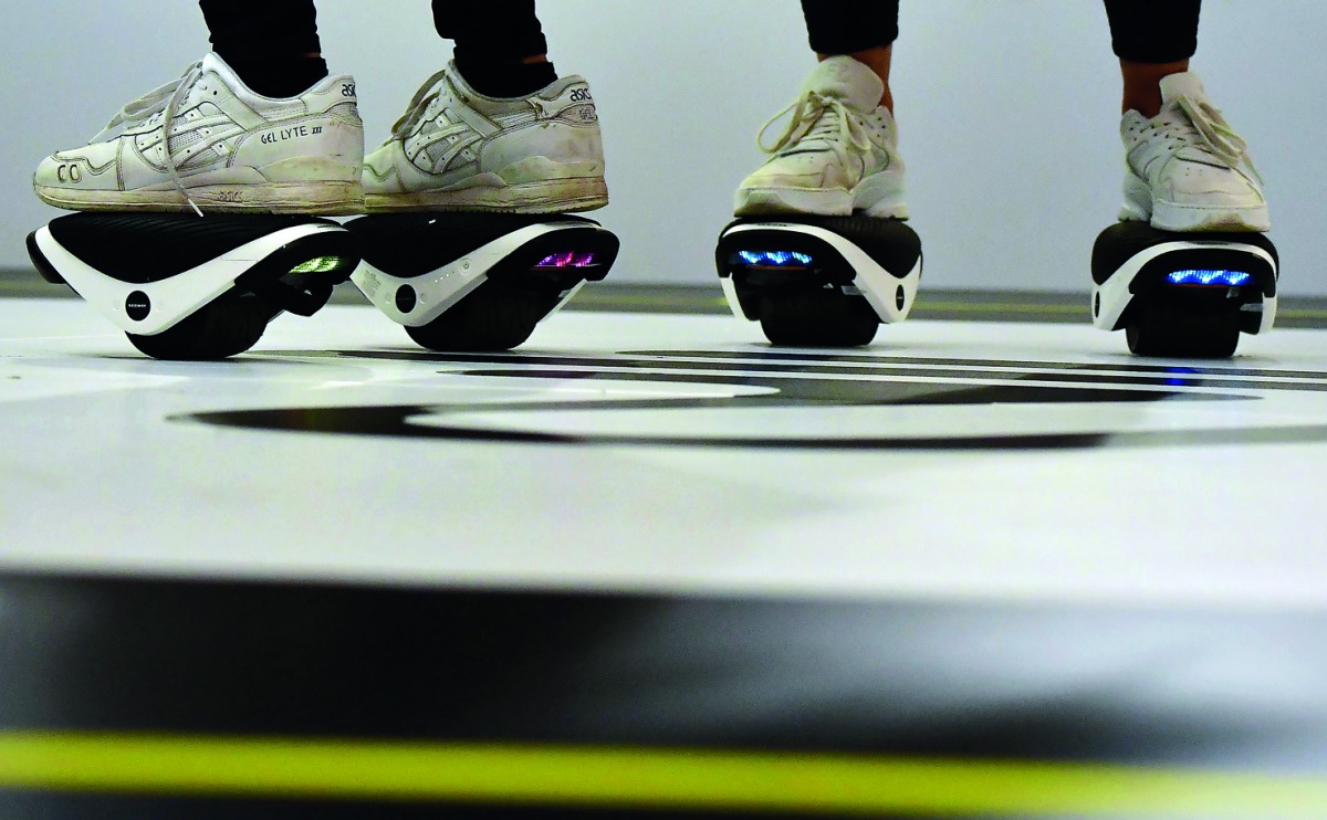 Booth hosts present the Drift W1 at the booth of Segway during a preview day of the IFA, the world's leading trade show for consumer electronics and home appliances, in Berlin on August 30, 2018. AFP / Tobias Schwarz