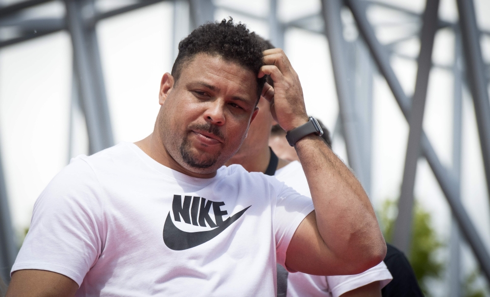 (FILES) In this file photo taken on June 12, 2018 former Brazilian international player Ronaldo gestures during a promotional event in Moscow, ahead of the Russia 2018 World Cup football tournament.  AFP / Mladen ANTONOV
