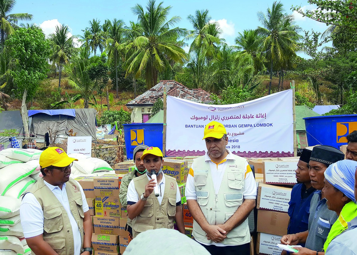 The officials supplying food items at a centre set up by QC in Indonesia.