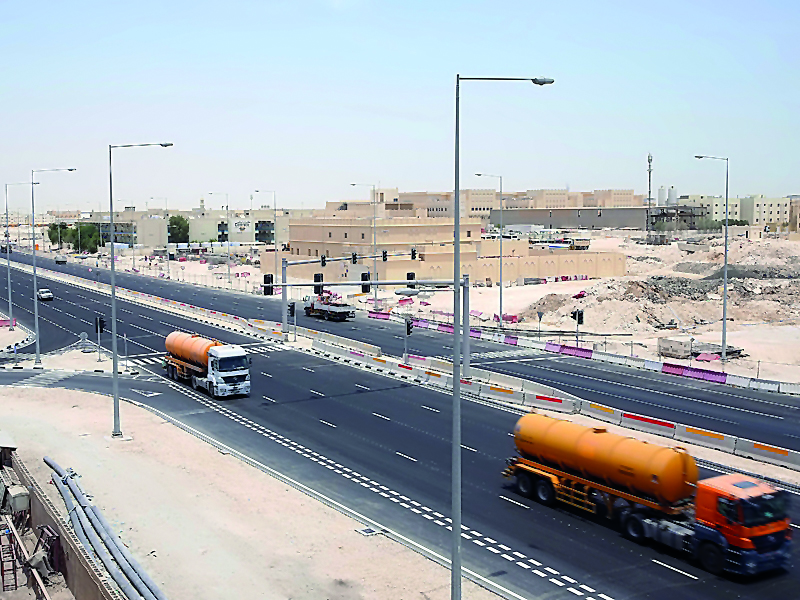 Vehicles move at the newly opened West Industrial Street. 