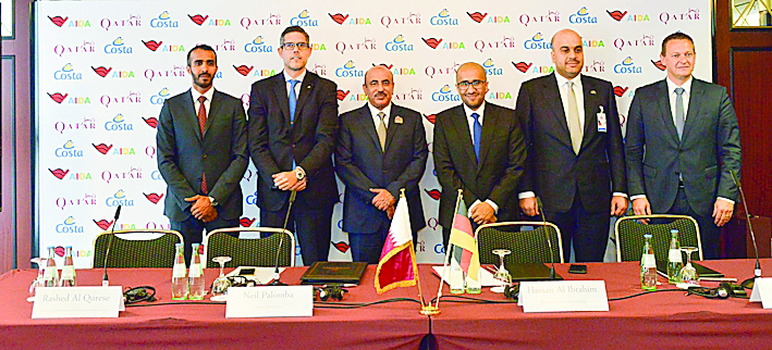 H E Jassim bin Saif Al Sulaiti (third left), Minister of Transport and Communications; Hassan Al Ibrahim (third right), QTA’s Acting Chairman, and Rashed Al Qurese (left), Chief Marketing and Promotion Officer at QTA, with other officials during the signi