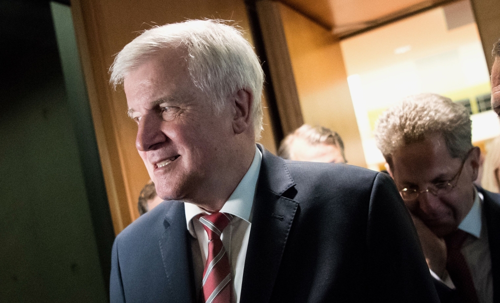 German Interior Minister Horst Seehofer and Hans-Georg Maassen (R), President of the domestic intelligence service of the Federal Republic of Germany (Bundesamt fuer Verfassungsschutz, BfV) leave after they faced a parliamentary committee of domestic and 