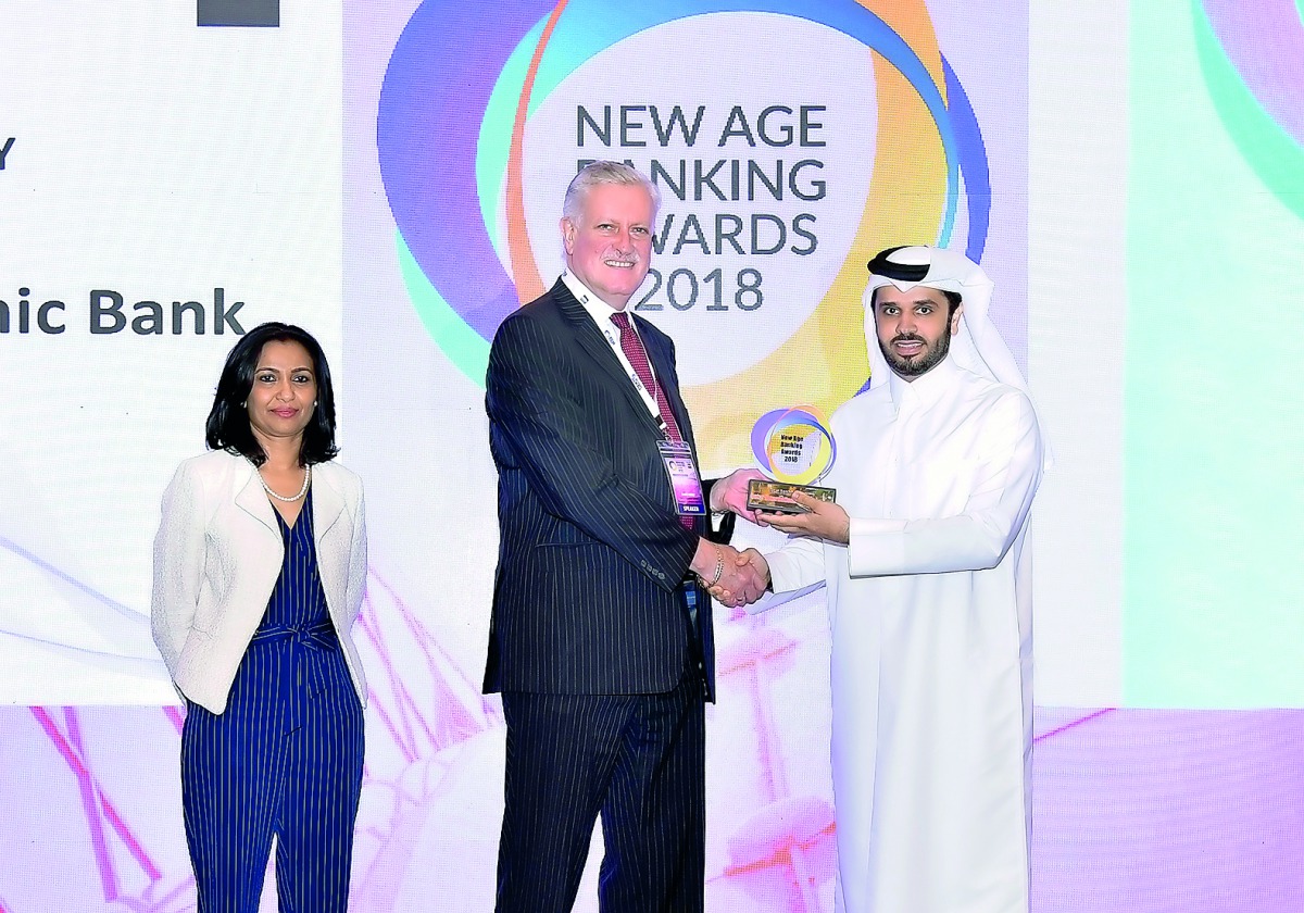 Omar Abdulaziz Al Meer (right), Chief of Business Development at QIIB, receiving the ‘Best Bank in Qatar Award in Liquidity’ on behalf of QIIB during the New Age Banking Summit.