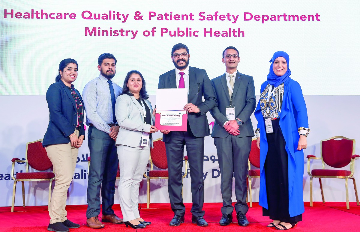 Dr. Sameer Moopen, CEO of Aster DM Healthcare Qatar, and other officials with the award. 