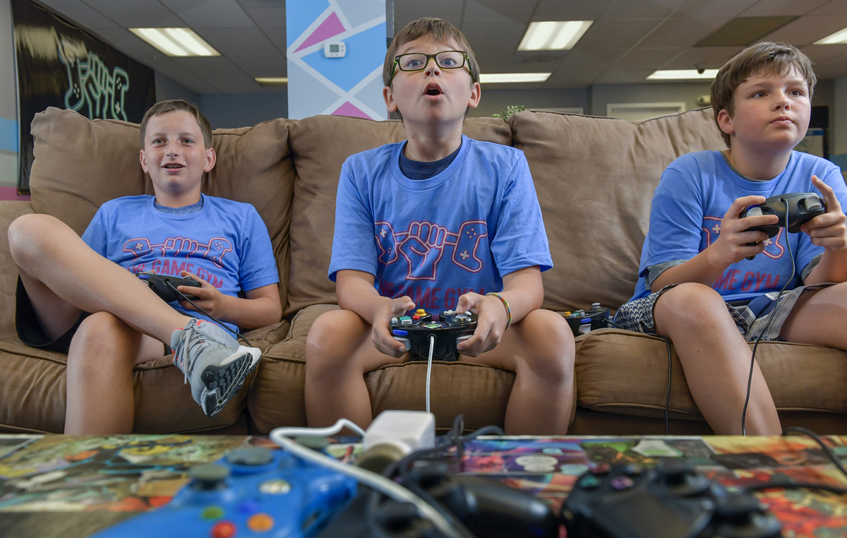 Aiden Keneally, Roman Wright and Benny O'Neill enjoy a game of Super Smash Brothers at a Game Gym camp in Potomac, Maryland, in late August. (Photo: Doug Kapustin / Washington Post)