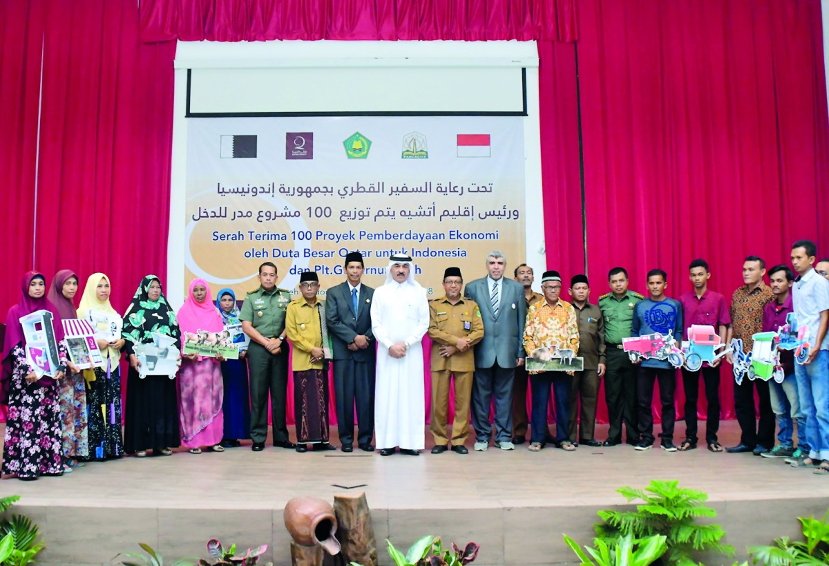 The beneficiaries of income-generation projects of QC in Indonesia with Ahmed Jassim Al Hamar, Ambassador of Qatar to Jakarta, and other officials.
