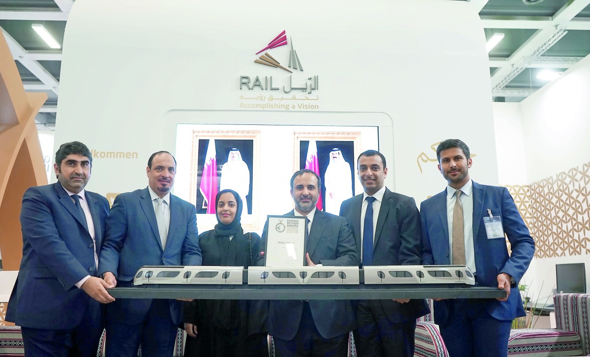 The dignitaries with a model of Doha Metro train.