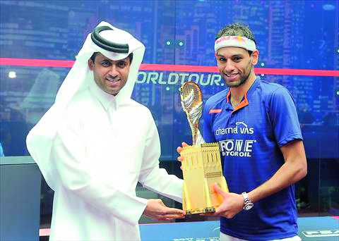 Nasser Ghanem Al Khelaifi, President of Qatar Tennis, Squash and Badminton Federation (QTSBF), handing over the Qatar Classic trophy to Mohamed El Shorbagy in this last November’s file photo.  