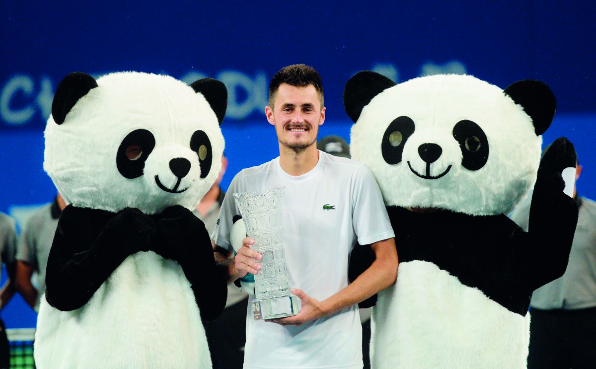 Bernard Tomic of Australia celebrates after winning the men's singles final against Fabio Fognini of Italy at the ATP Chengdu Open tennis tournament in Chengdu, in China's southwest Sichuan province on September 30, 2018. China OUT
/ AFP 