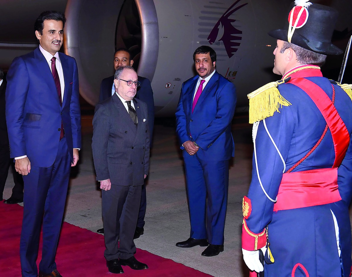 Amir H H Sheikh Tamim bin Hamad Al Thani being received at the Ministro Pistarini International Airport  in Buenos Aires by the Minister of Foreign Affairs of the Argentine Republic, Jorge Faure, yesterday.