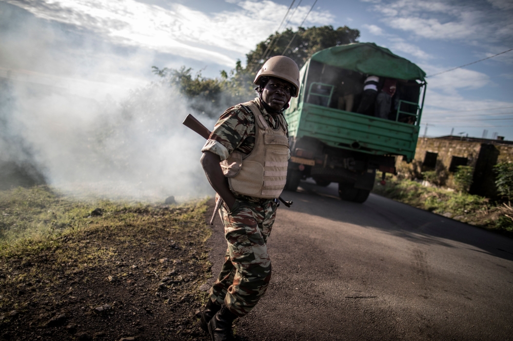 Electoral officials leave onboard of a truck with polling materials ahead of deployment in Buea, southwestern Cameroon, on October 7, 2018 during presidential election.   AFP / MARCO LONGARI