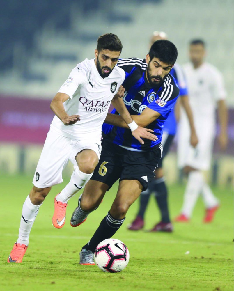 Al Sadd’s Hassan Al Haydos (left) vies for ball possession with an Al Sailiya player during their QNB Stars League match in Doha yesterday.