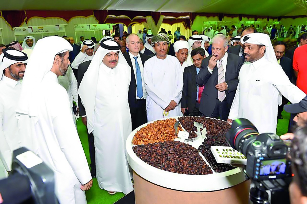 Minister of Environment and Municipality H E Mohamed bin Abdullah Al Rumaihi and other officials at the exhibition in Souq Waqif. 
