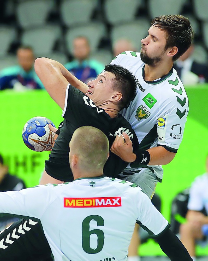 Al Sadd and Füchse Berlin players in action during last year's IHF Super Globe semi-final in Doha.