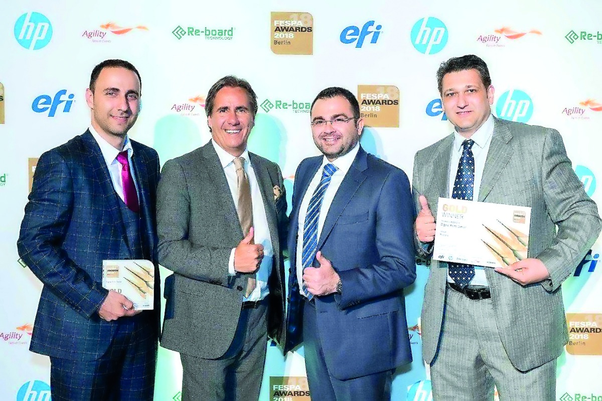 Digital Print Center officials with the award.