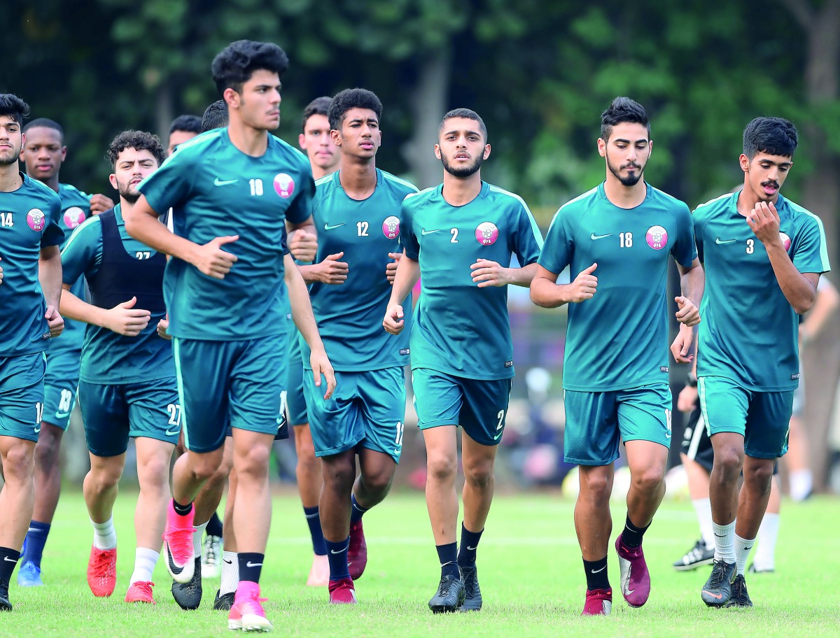 Qatari players take part in a practice session on the eve of their opening match of the AFC U-19  Championship against the United Arab Emirates in Jakarta, Indonesia yesterday. Picture: Fadi Al Assaad
