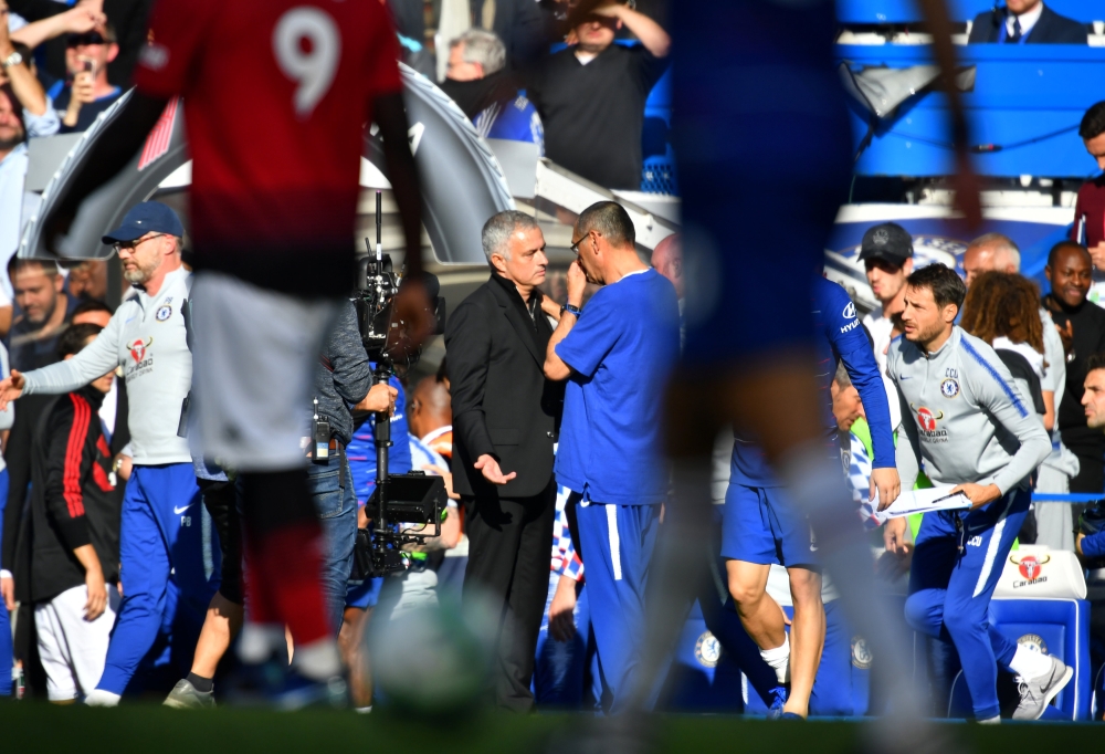 Manchester United manager Jose Mourinho and Chelsea manager Maurizio Sarri speak after the match REUTERS/Dylan Martinez