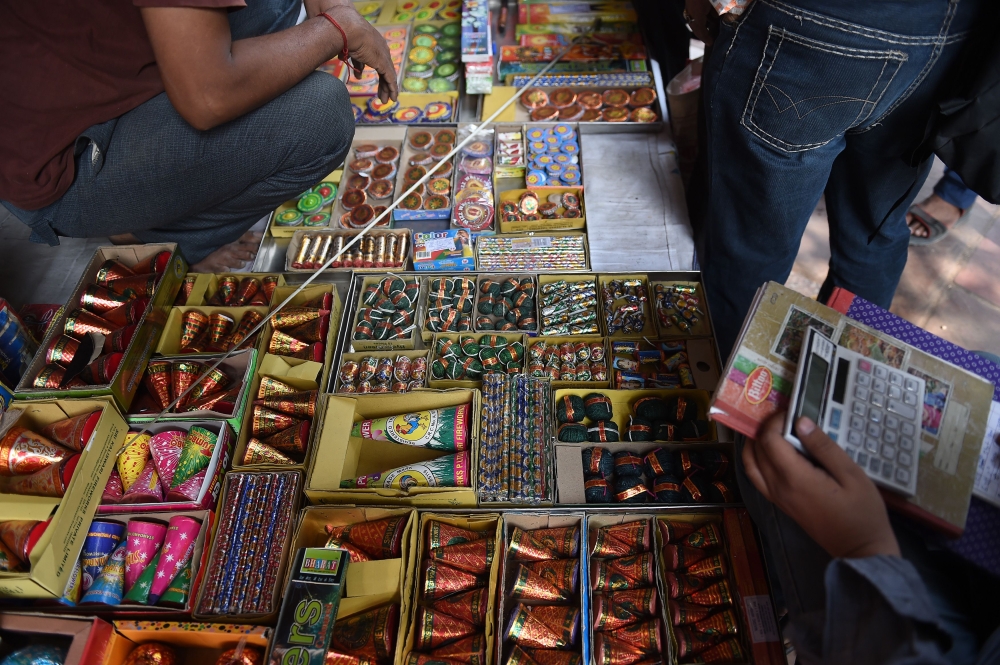 Sparks fly as India allows "green" firecrackers for Diwali The